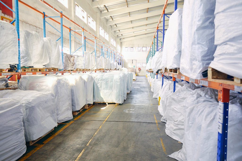 Used bulk bags under covers in the Custom Bulk Bags warehouse