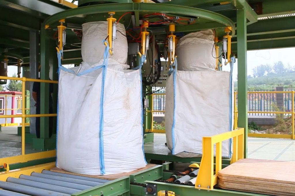 Bulk bags with inlet spout attached to filling machinery
