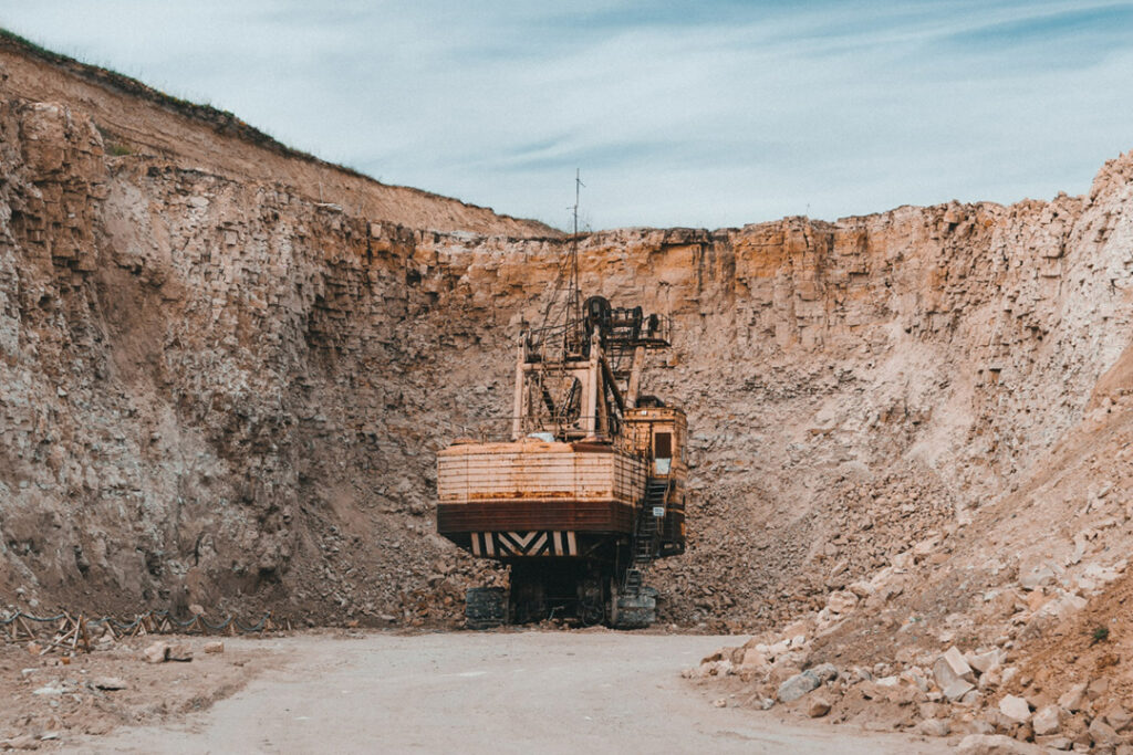 A large excavator removing ore from an open cast copper mine.