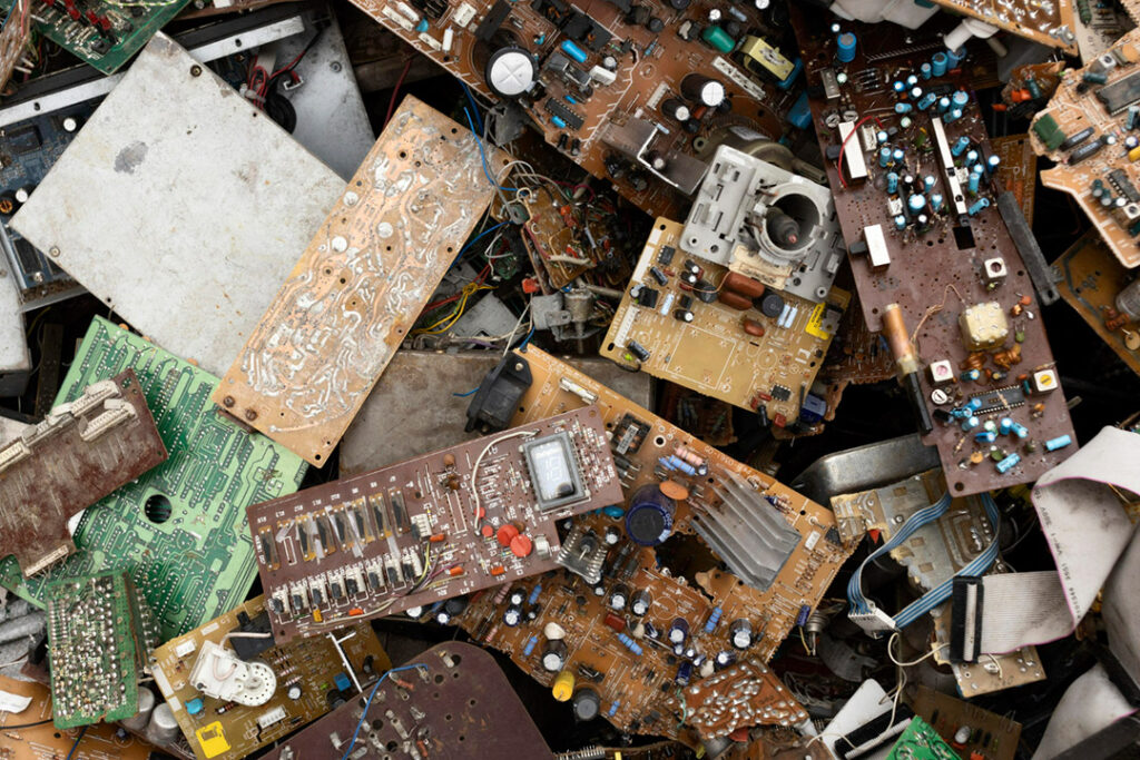 A pile rusty old electronic waste