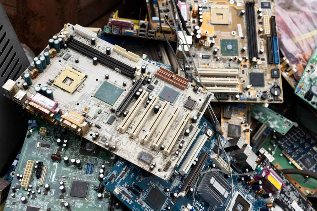 A small pile of electronic waste and circuit boards.