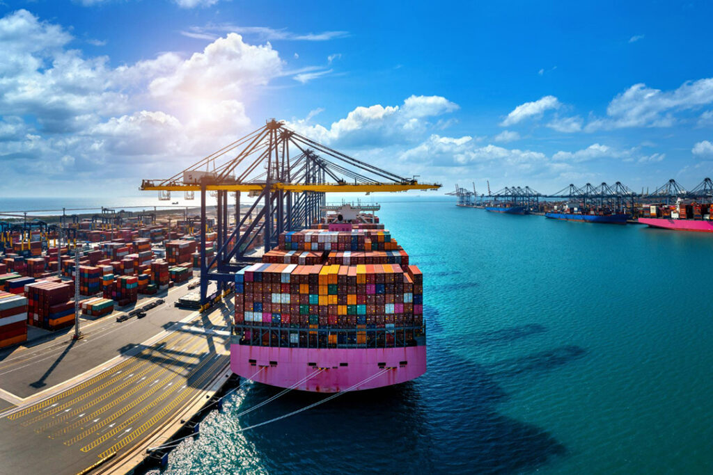 A large ship with containers in a port