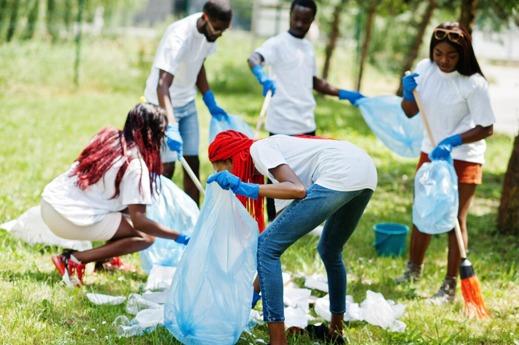 A team of volunteers picking up litter for a community clean-up campaign