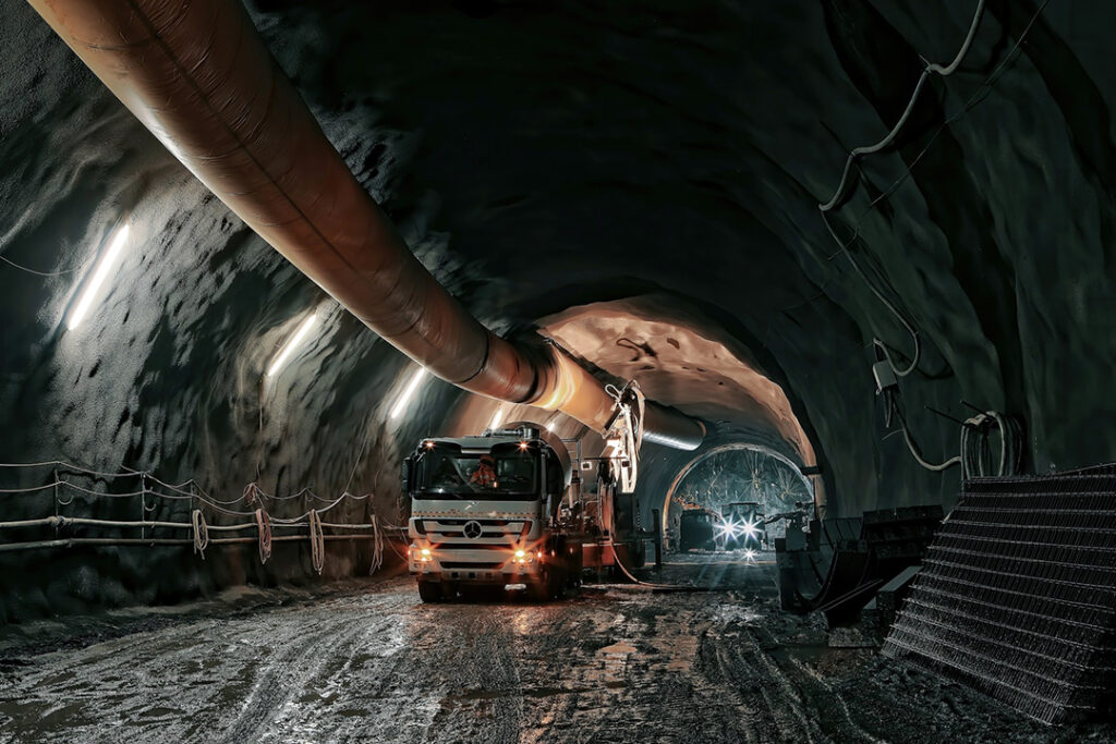 A mining lorry moving washings inside a mining tunnel.