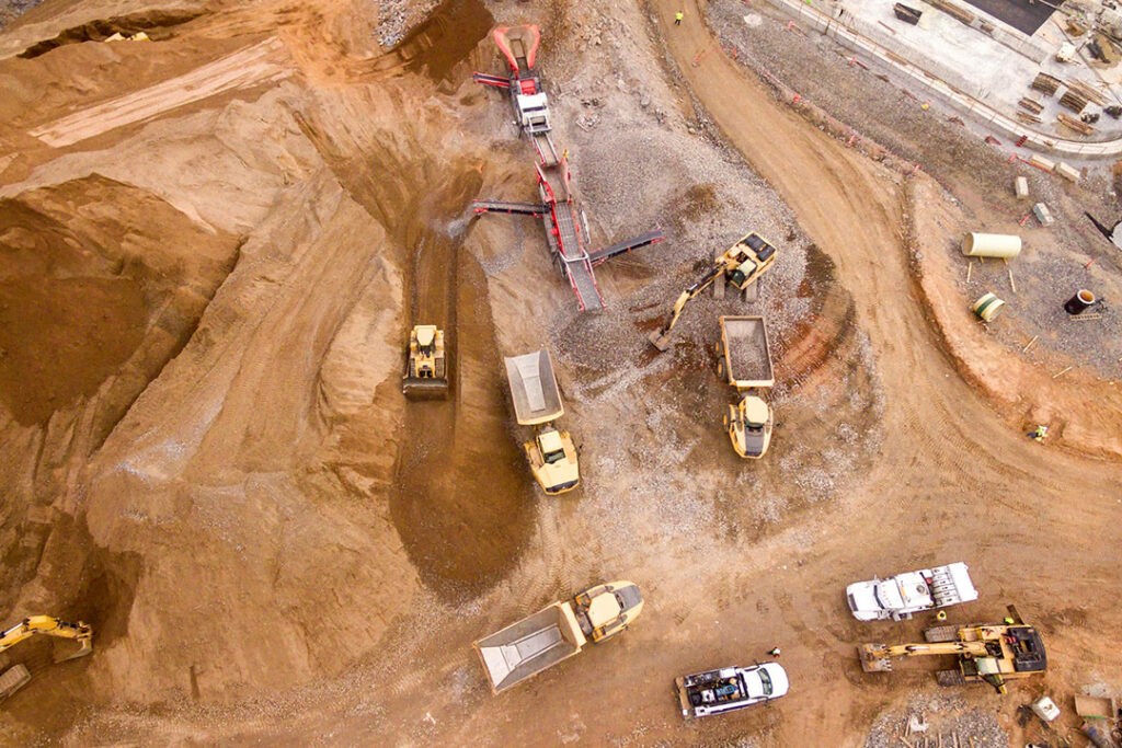 An aerial view of mining machinery on an open pit mine.